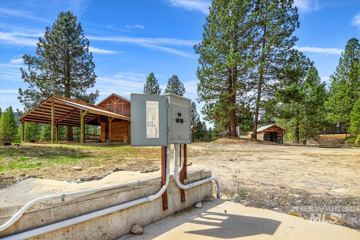 29 McIntyre Gulch Road Boise, ID 83716 - Photo 13 of 50 Large concrete pad (40’ x 50’) with power—ideal for shop, barn, future build or RV parking for guests, events or income potential.
