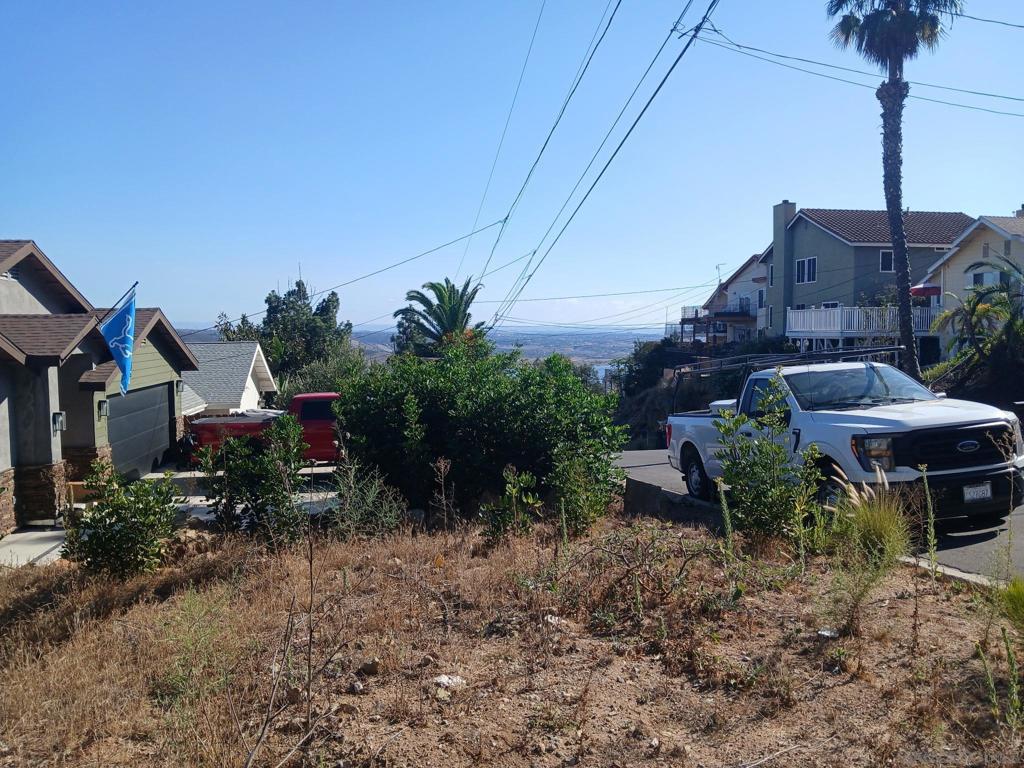 Undisclosed Address Spring Valley, CA 91977 - Photo 6 of 8 a view of a house with a yard and sitting area