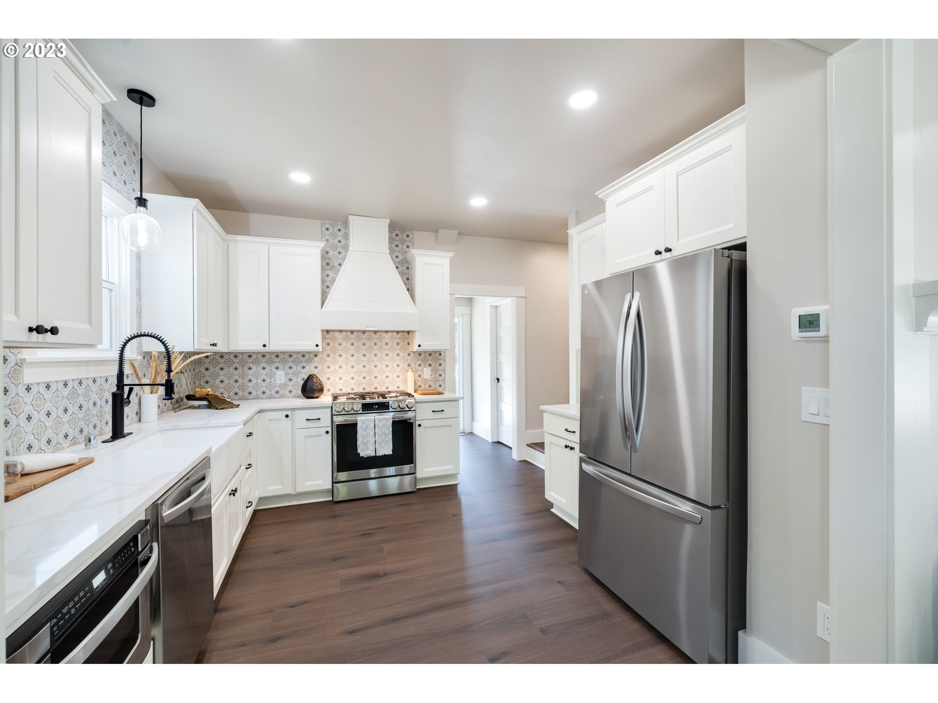 914 Northwest 7th Avenue Camas, WA 98607 - Photo 11 of 26 a kitchen with a refrigerator and a sink