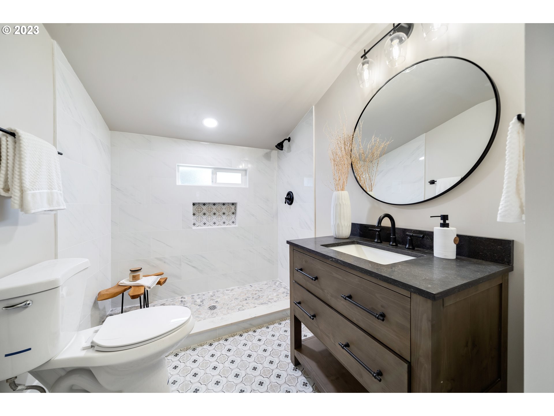914 Northwest 7th Avenue Camas, WA 98607 - Photo 21 of 26 a bathroom with a granite countertop sink a mirror and a toilet