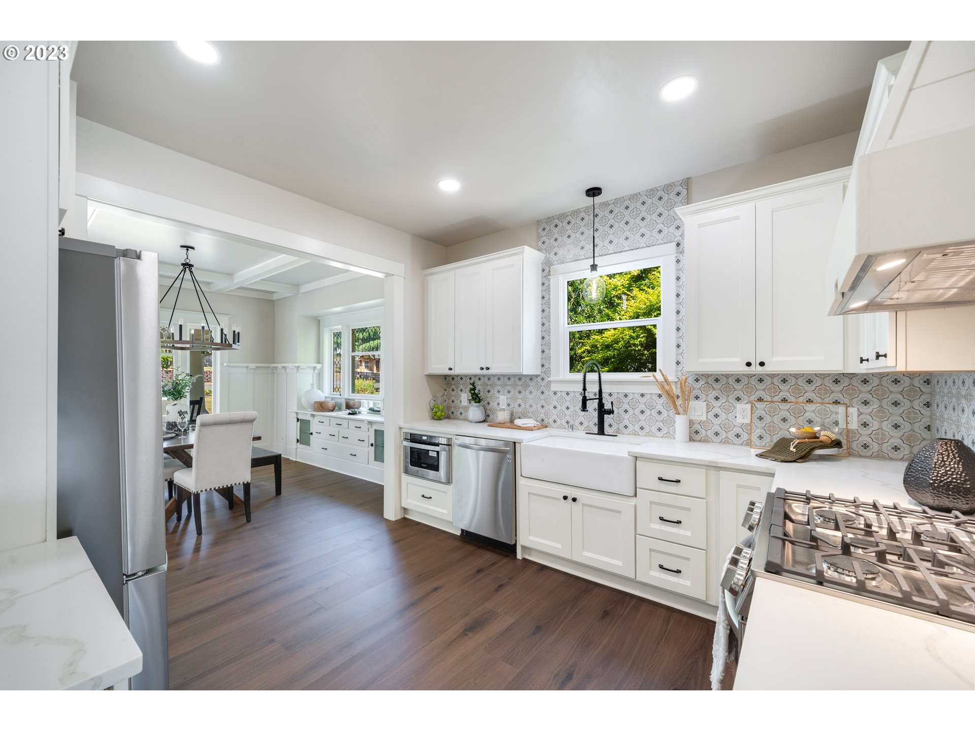 914 Northwest 7th Avenue Camas, WA 98607 - Photo 8 of 26 a kitchen with lots of counter top space and wooden floor