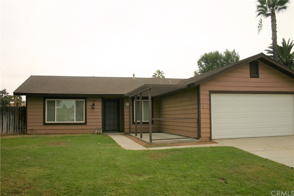 a house view with a garden space