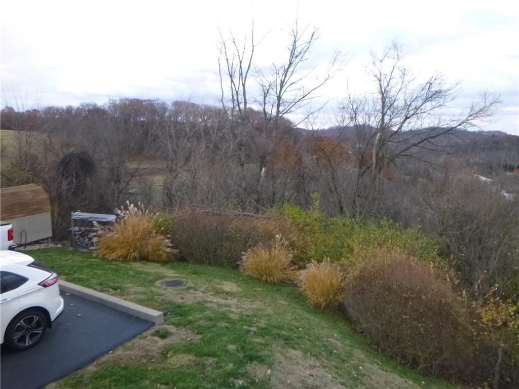 133 Pinto Drive, Unit PINTO DRIVE Plum, PA 15239 - Photo 15 of 21 a view of a backyard with seating area and green space