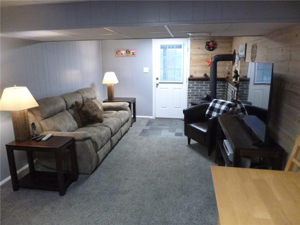 133 Pinto Drive, Unit PINTO DRIVE Plum, PA 15239 - Photo 17 of 21 a living room with furniture and a lamp