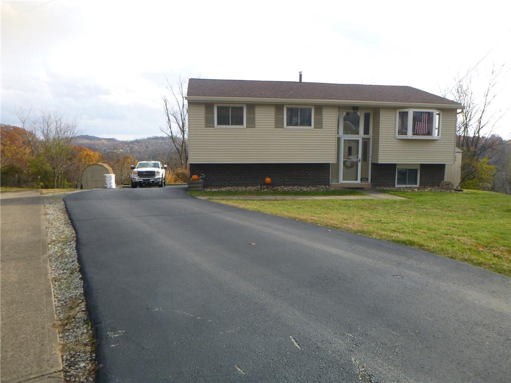 133 Pinto Drive, Unit PINTO DRIVE Plum, PA 15239 - Photo 2 of 21 a front view of a house with a yard