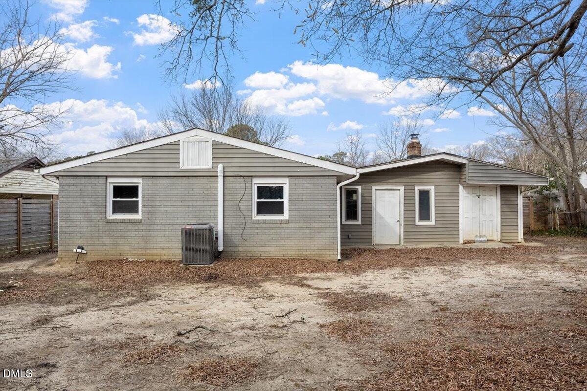 713 Friar Tuck Road Raleigh, NC 27610 - Photo 25 of 29 a view of a house with a yard