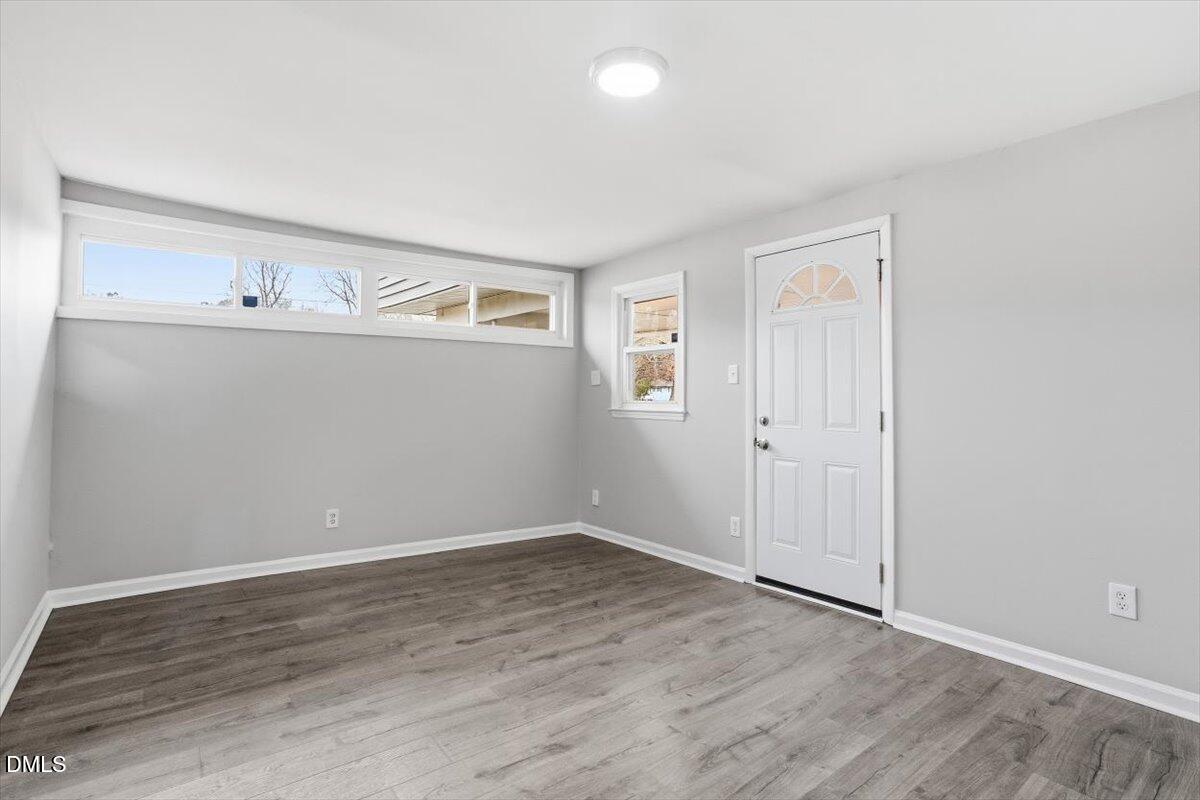 713 Friar Tuck Road Raleigh, NC 27610 - Photo 7 of 29 wooden floor in an empty room
