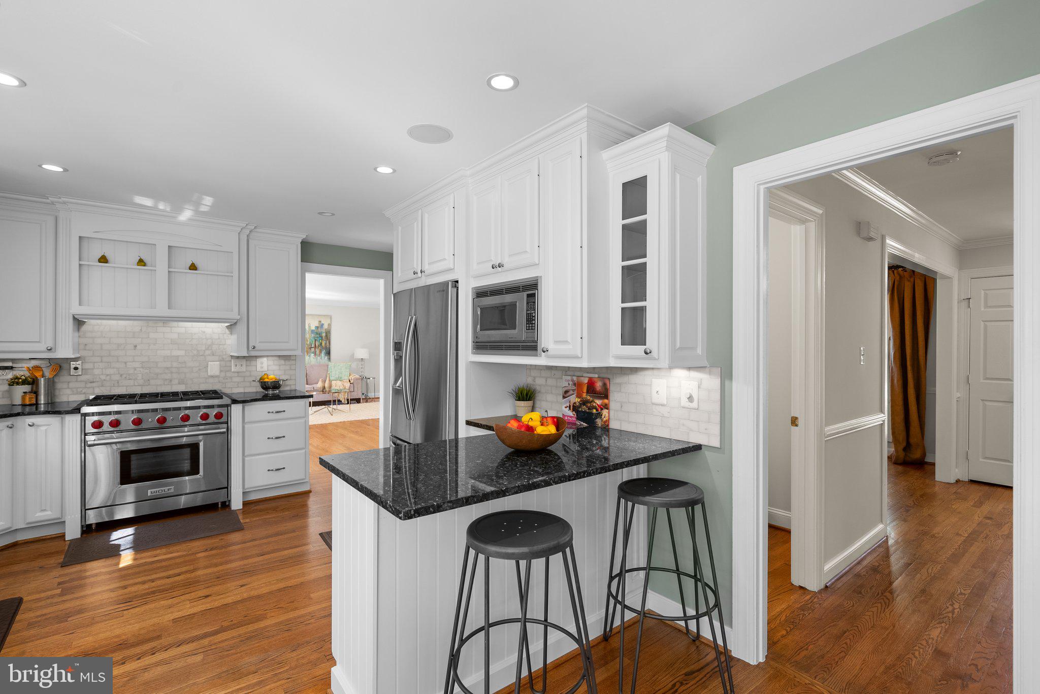 3106 Russell Road Alexandria, VA 22305 - Photo 11 of 62 a kitchen with stainless steel appliances granite countertop a stove and a refrigerator
