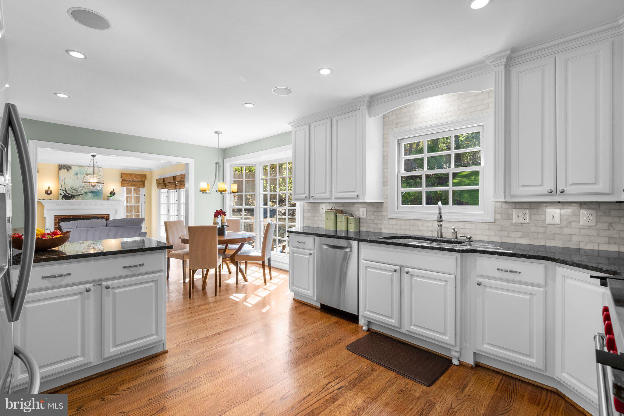 3106 Russell Road Alexandria, VA 22305 - Photo 15 of 62 a kitchen with lots of counter top space and dining table