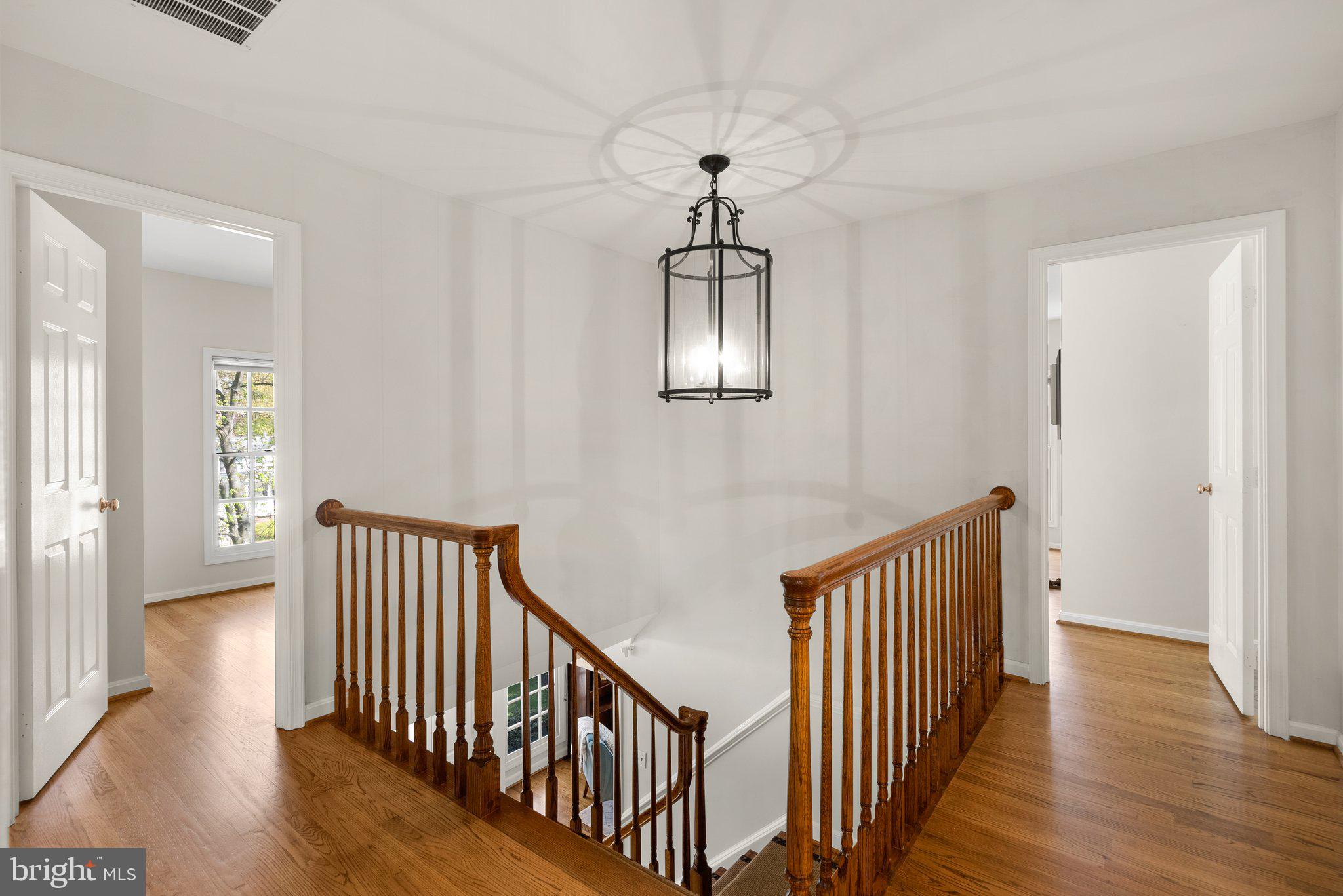 3106 Russell Road Alexandria, VA 22305 - Photo 27 of 62 a view of a hallway with wooden floor and windows
