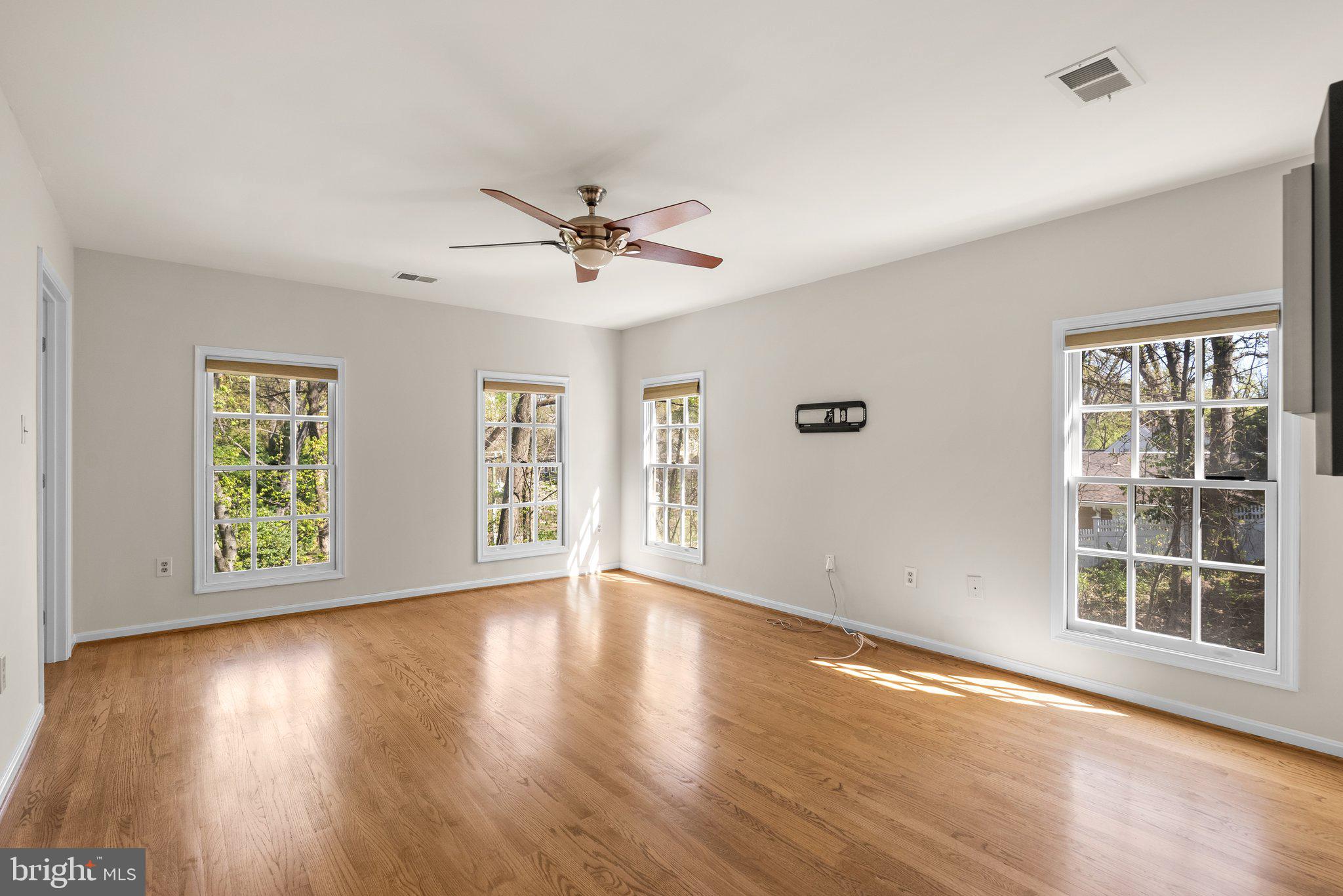 3106 Russell Road Alexandria, VA 22305 - Photo 28 of 62 a view of an empty room with a window and wooden floor