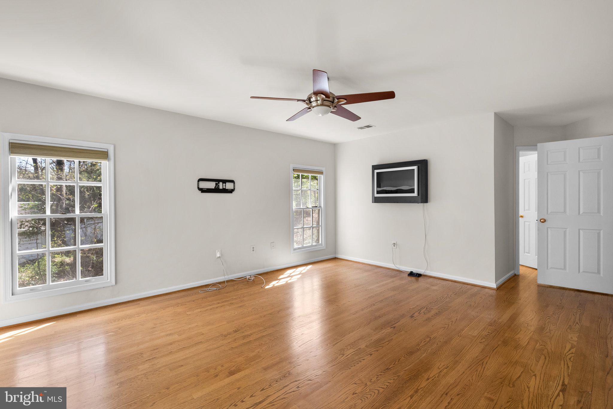 3106 Russell Road Alexandria, VA 22305 - Photo 29 of 62 a view of empty room with wooden floor and fan