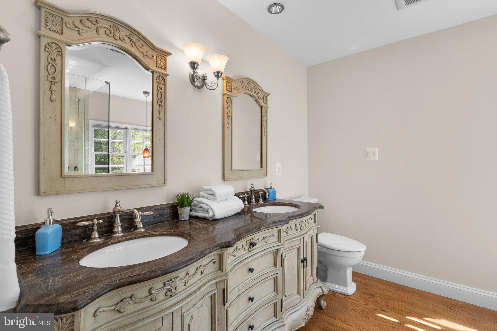 3106 Russell Road Alexandria, VA 22305 - Photo 32 of 62 a bathroom with a granite countertop double vanity sink and a mirror