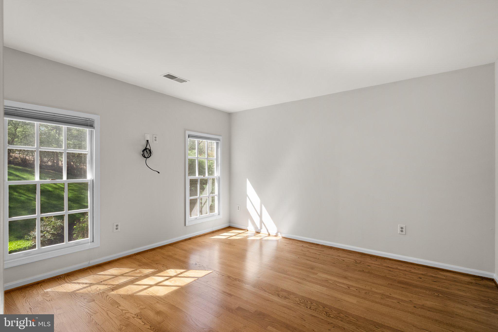 3106 Russell Road Alexandria, VA 22305 - Photo 34 of 62 a view of empty room with wooden floor and fan