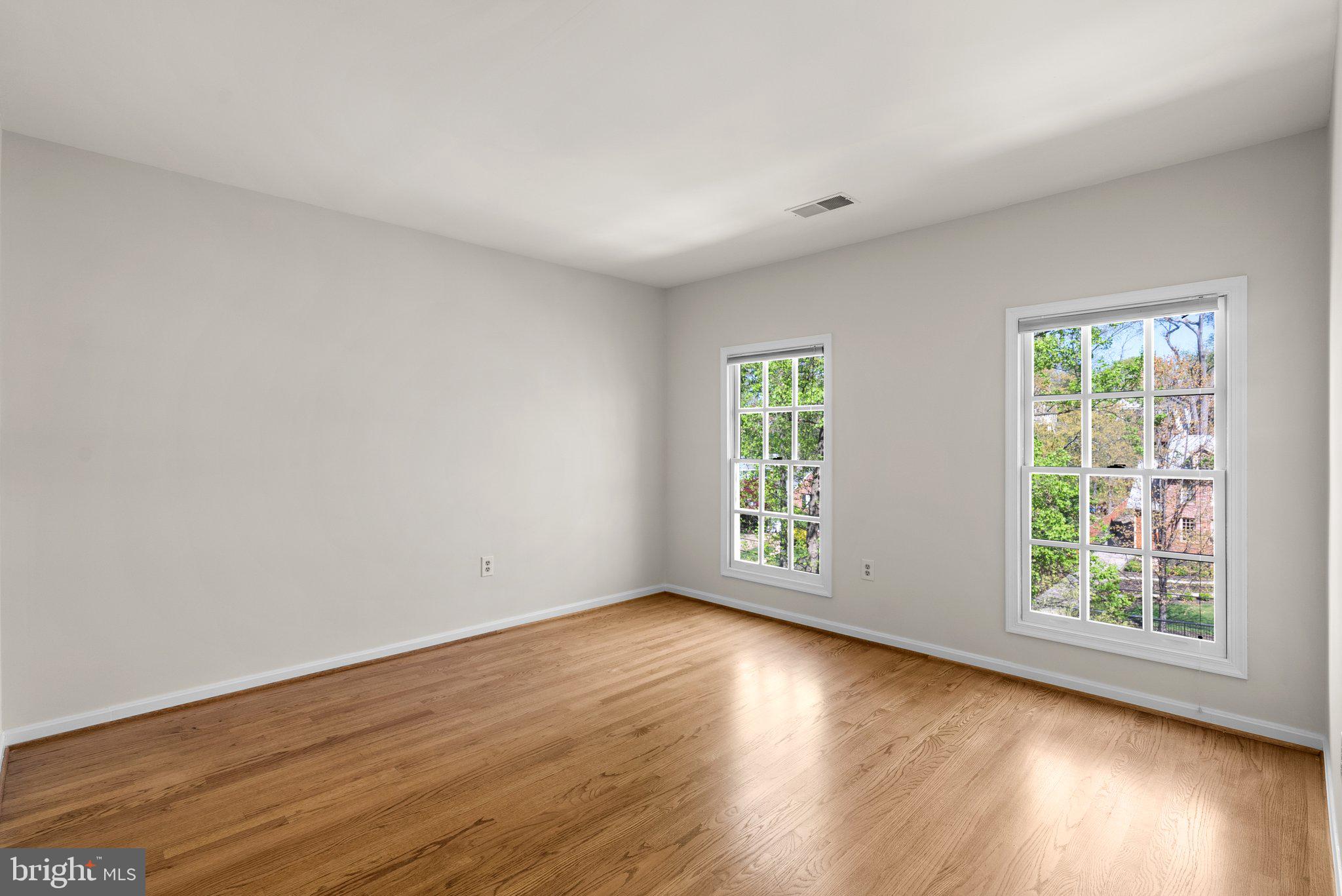 3106 Russell Road Alexandria, VA 22305 - Photo 36 of 62 an empty room with wooden floor and windows