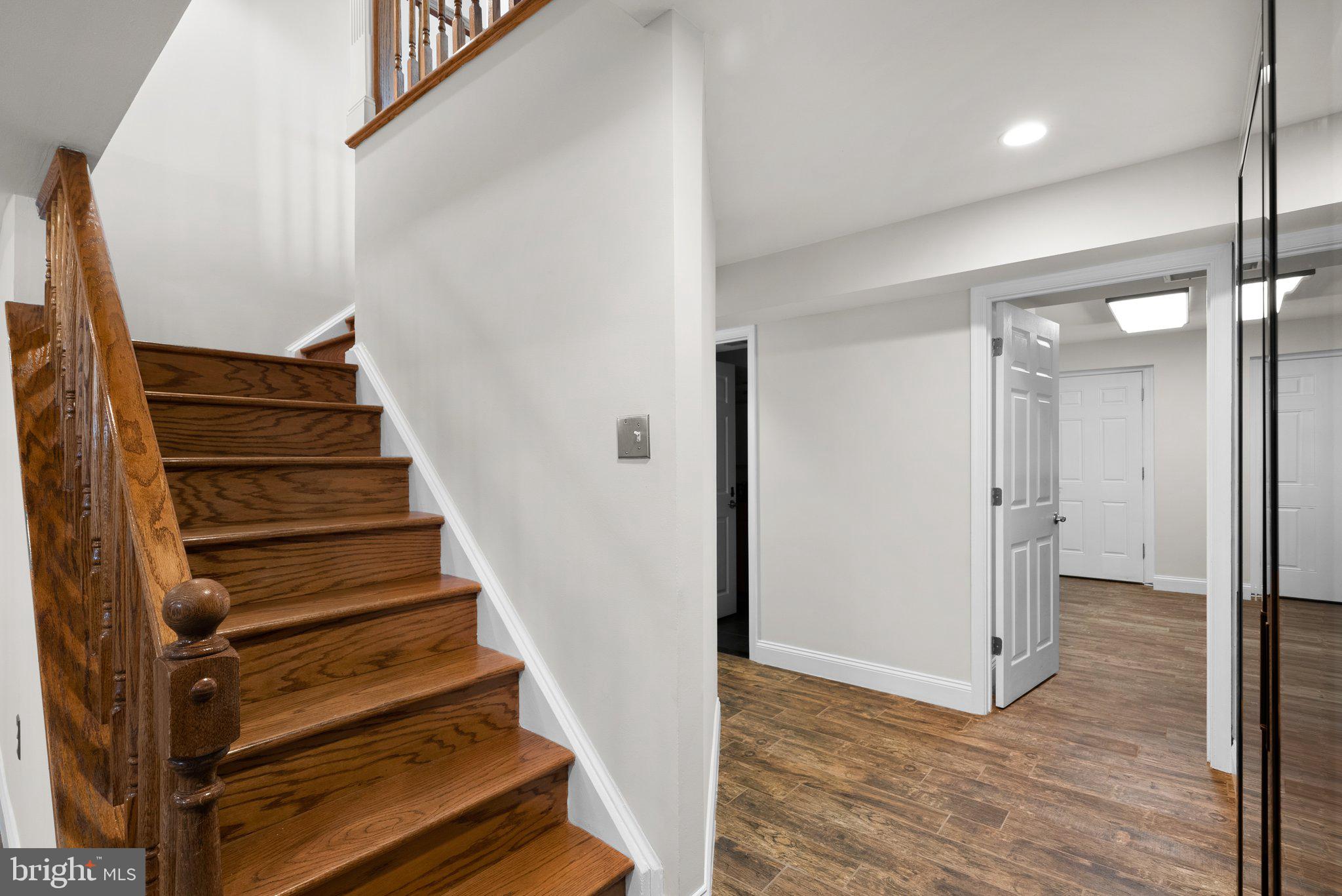 3106 Russell Road Alexandria, VA 22305 - Photo 40 of 62 a view of entryway with wooden floor and stairs