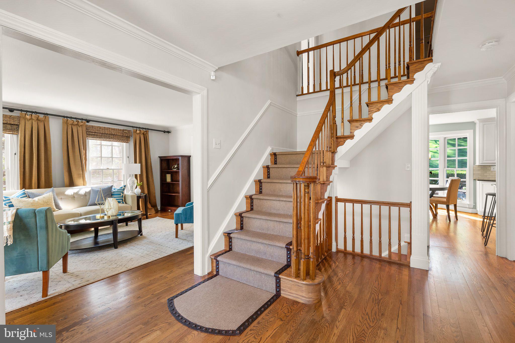3106 Russell Road Alexandria, VA 22305 - Photo 4 of 62 a view of staircase with wooden floor and a window