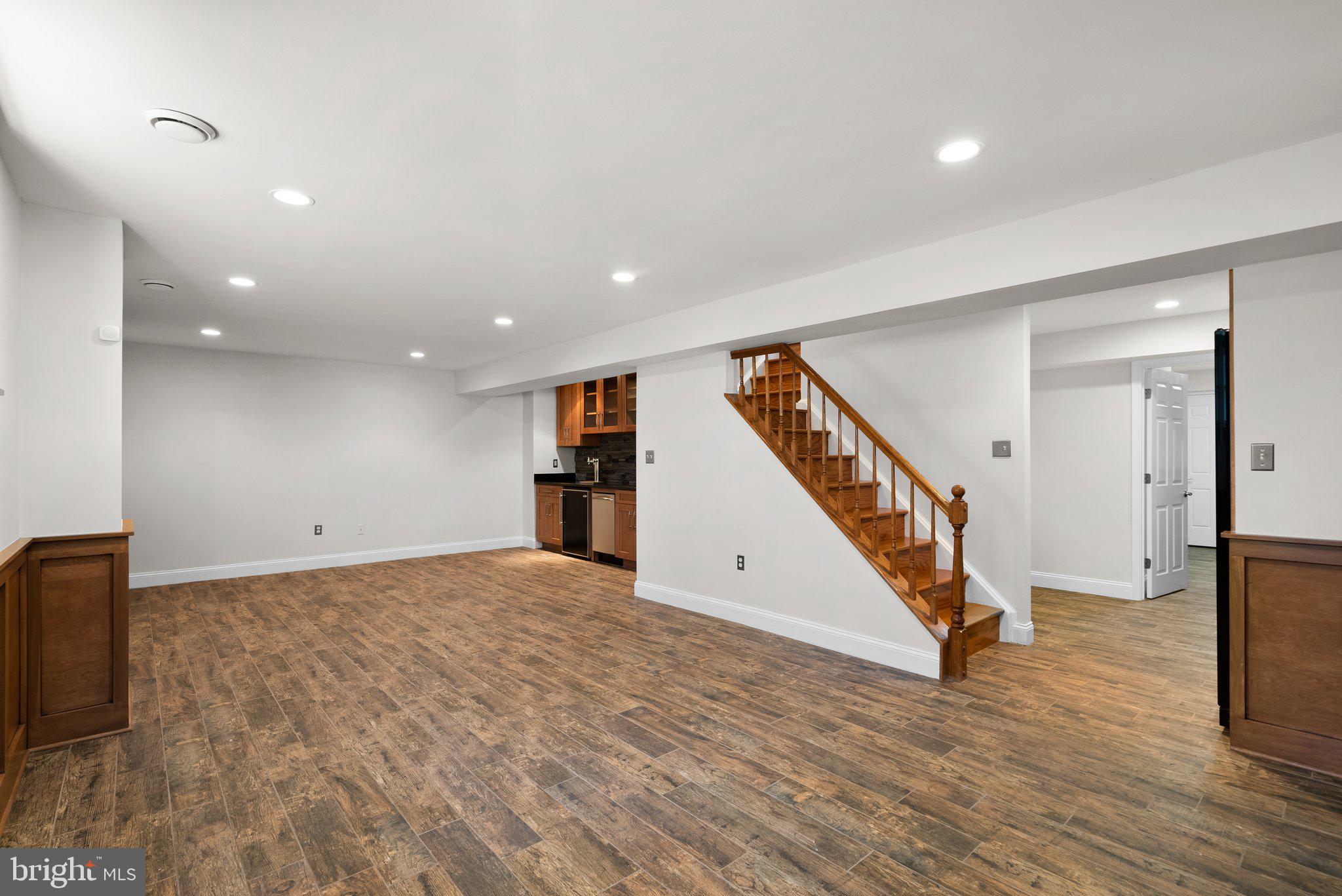 3106 Russell Road Alexandria, VA 22305 - Photo 41 of 62 a view of an empty room with wooden floor and stairs