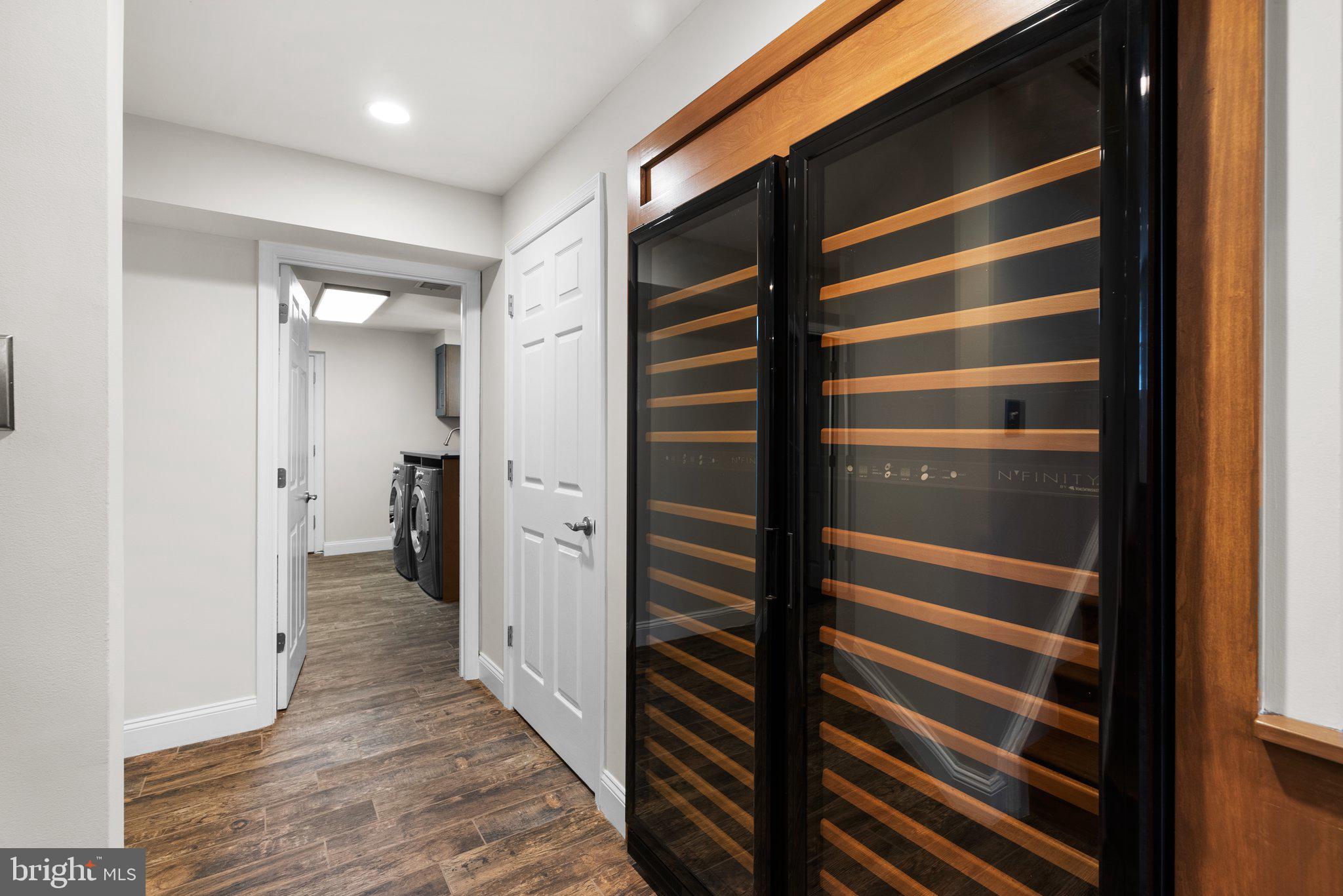3106 Russell Road Alexandria, VA 22305 - Photo 46 of 62 a view of walk in closet and bedroom with wooden floor