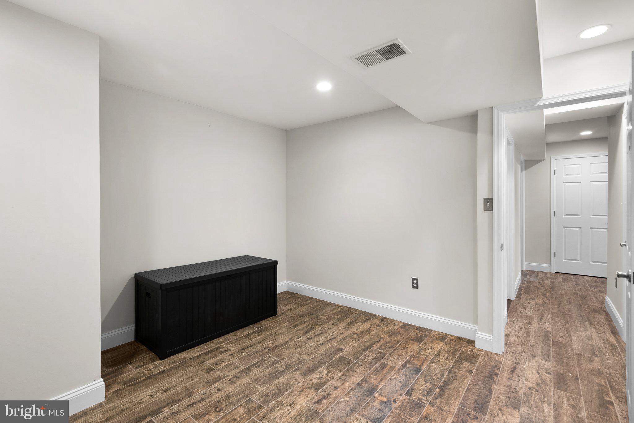 3106 Russell Road Alexandria, VA 22305 - Photo 48 of 62 a view of empty room with wooden floor