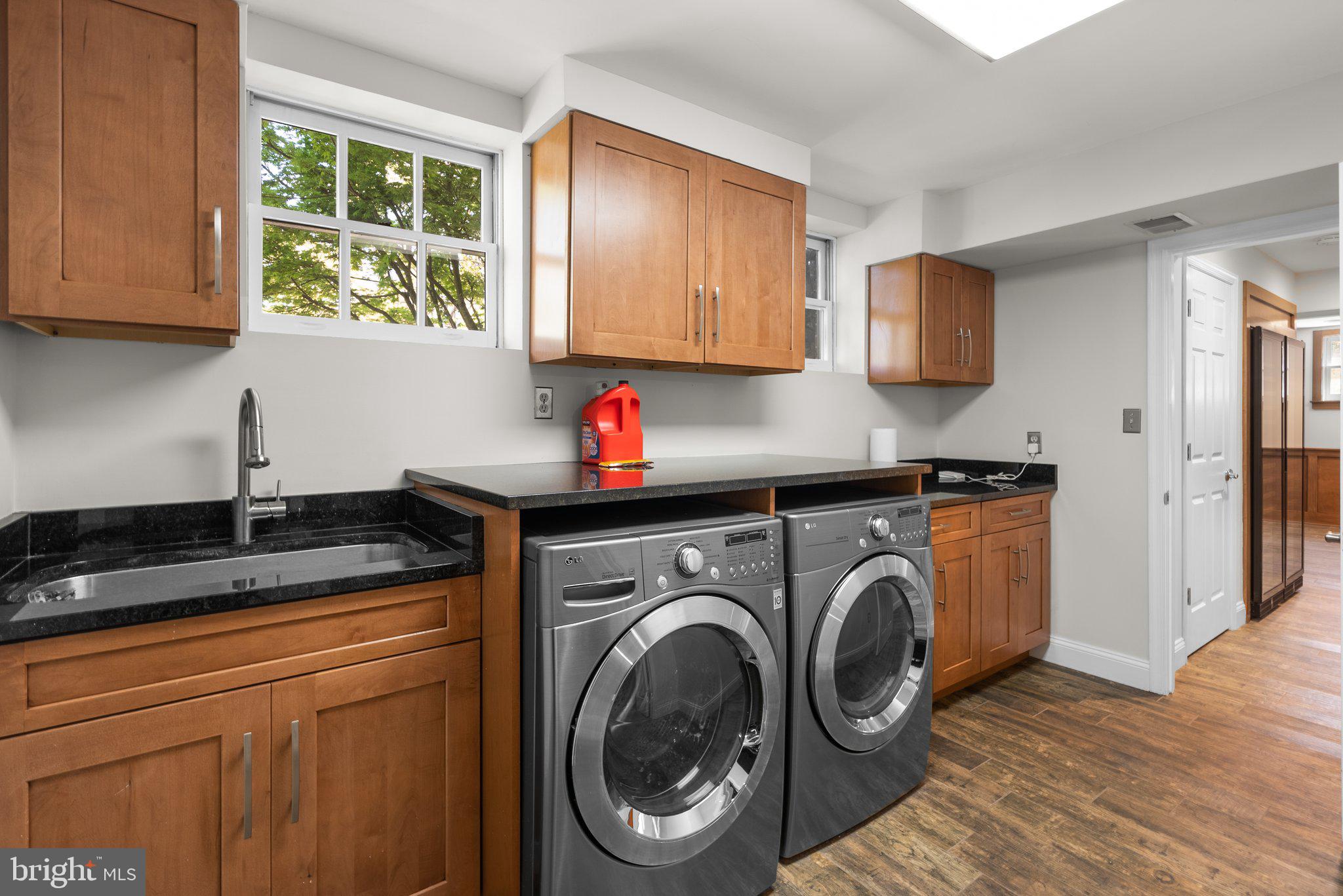 3106 Russell Road Alexandria, VA 22305 - Photo 51 of 62 a kitchen with stainless steel appliances granite countertop a sink a stove and a refrigerator