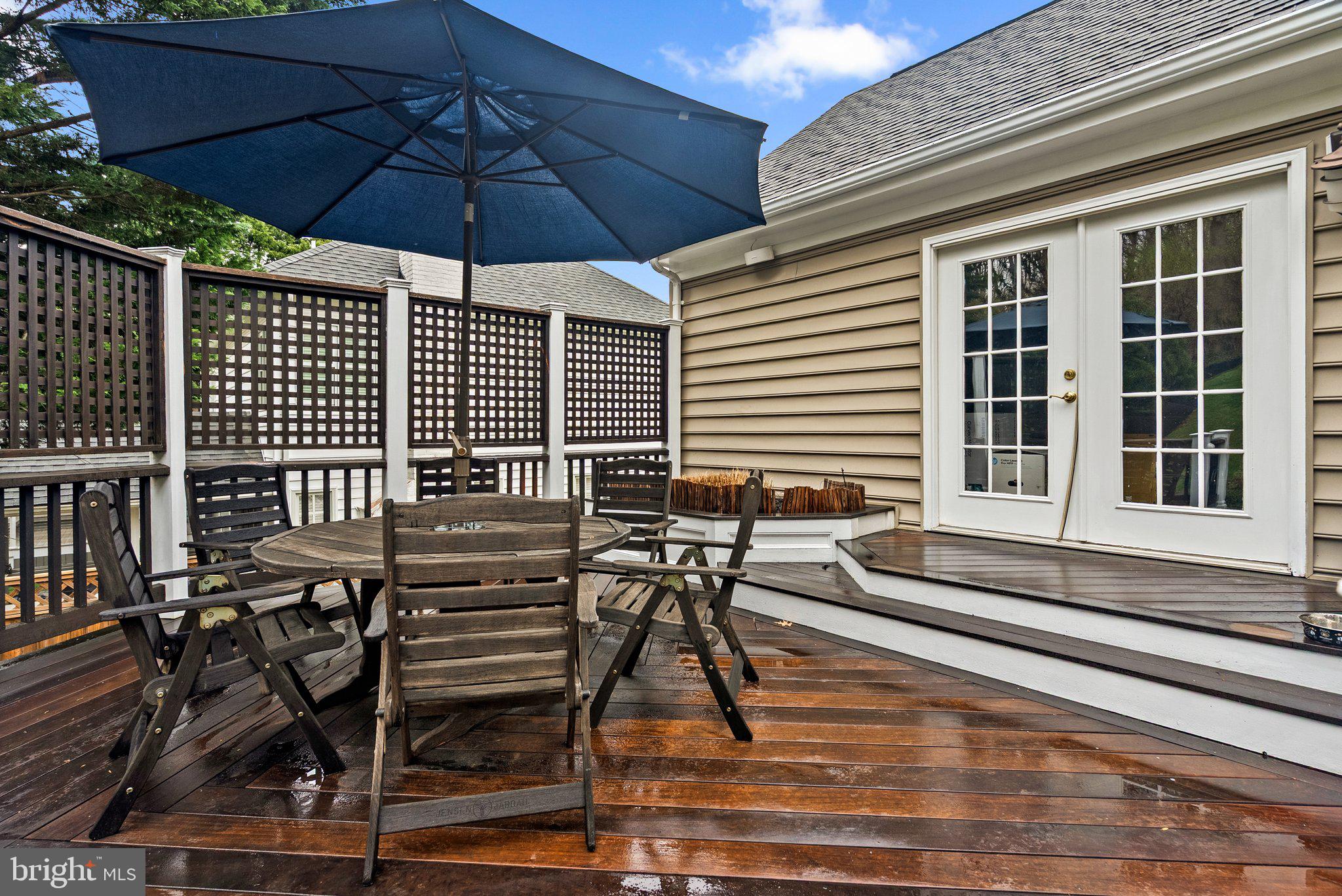 3106 Russell Road Alexandria, VA 22305 - Photo 56 of 62 a view of a patio with table and chairs under an umbrella