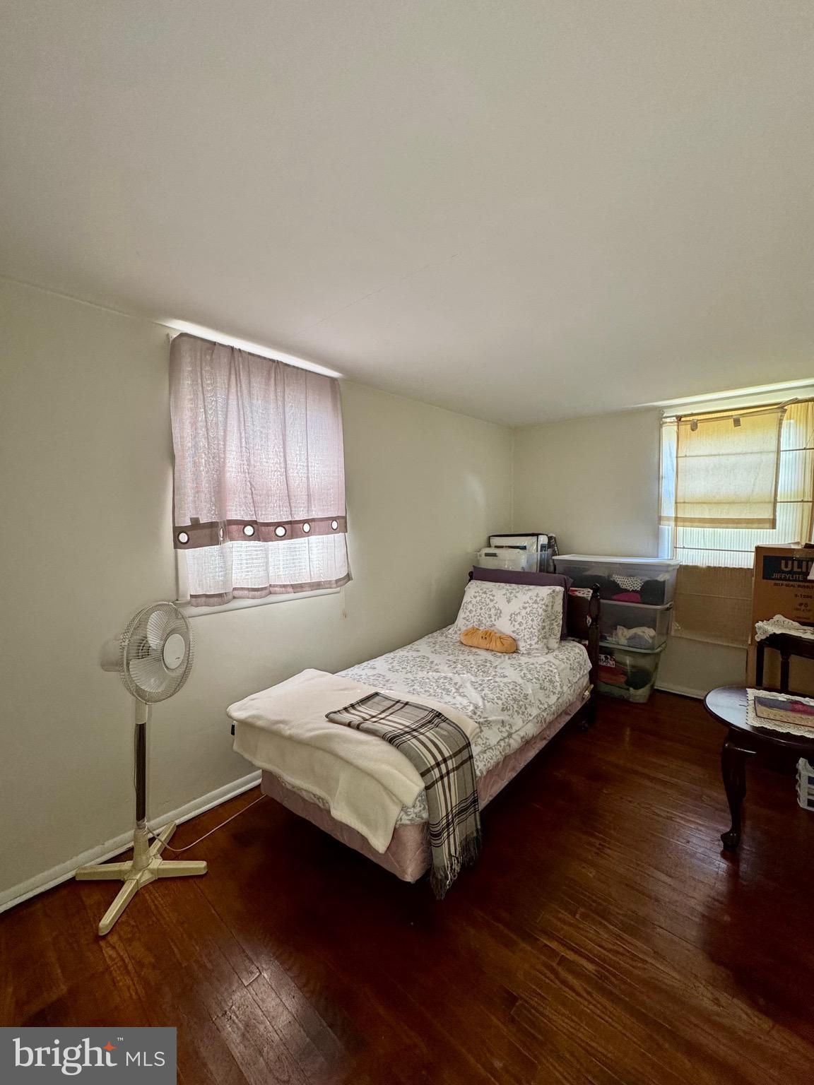 236 Willard Drive Ridley Park, PA 19078 - Photo 14 of 19 a bedroom with a bed and wooden floor
