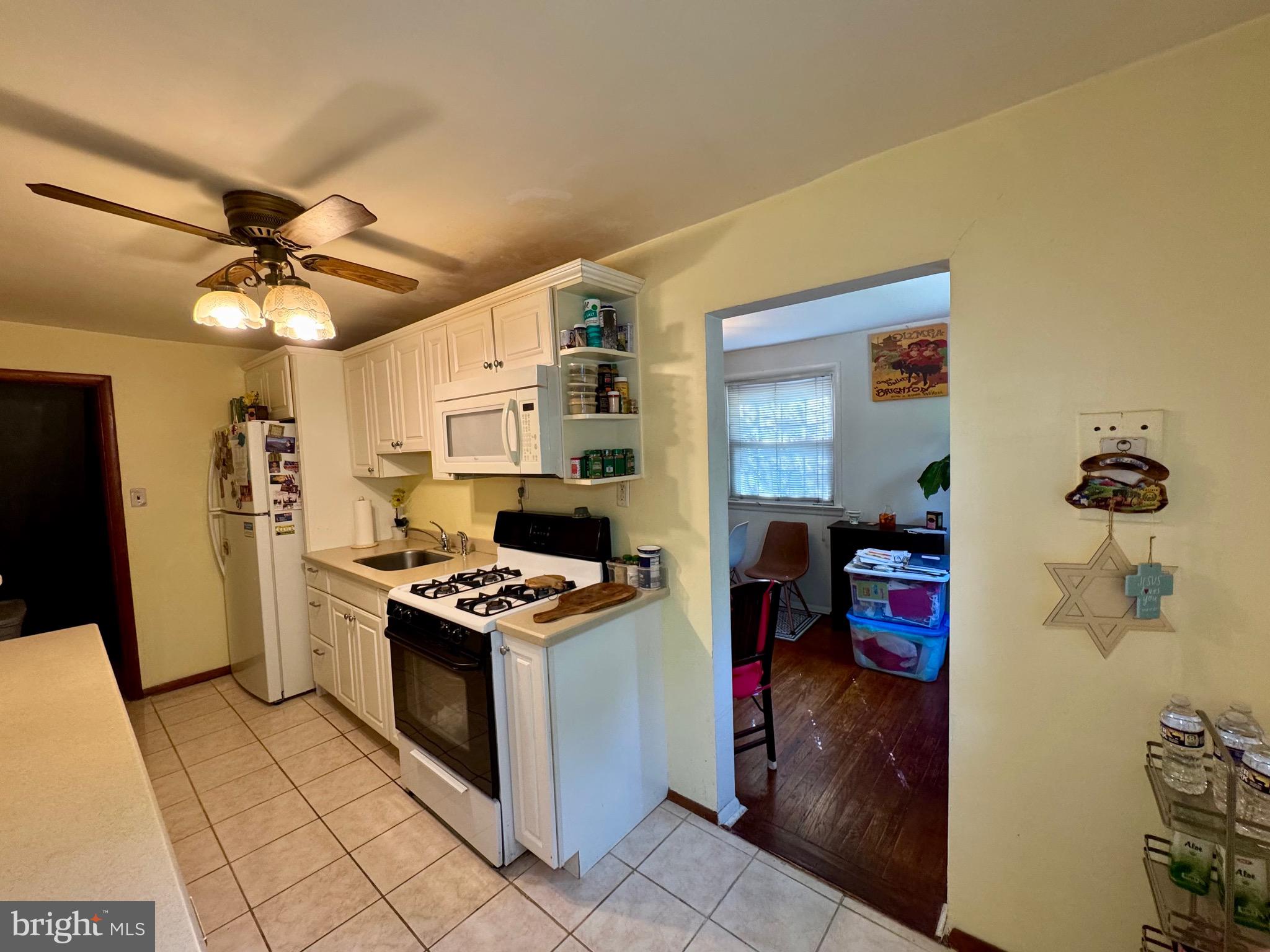236 Willard Drive Ridley Park, PA 19078 - Photo 5 of 19 a kitchen with a stove and a refrigerator