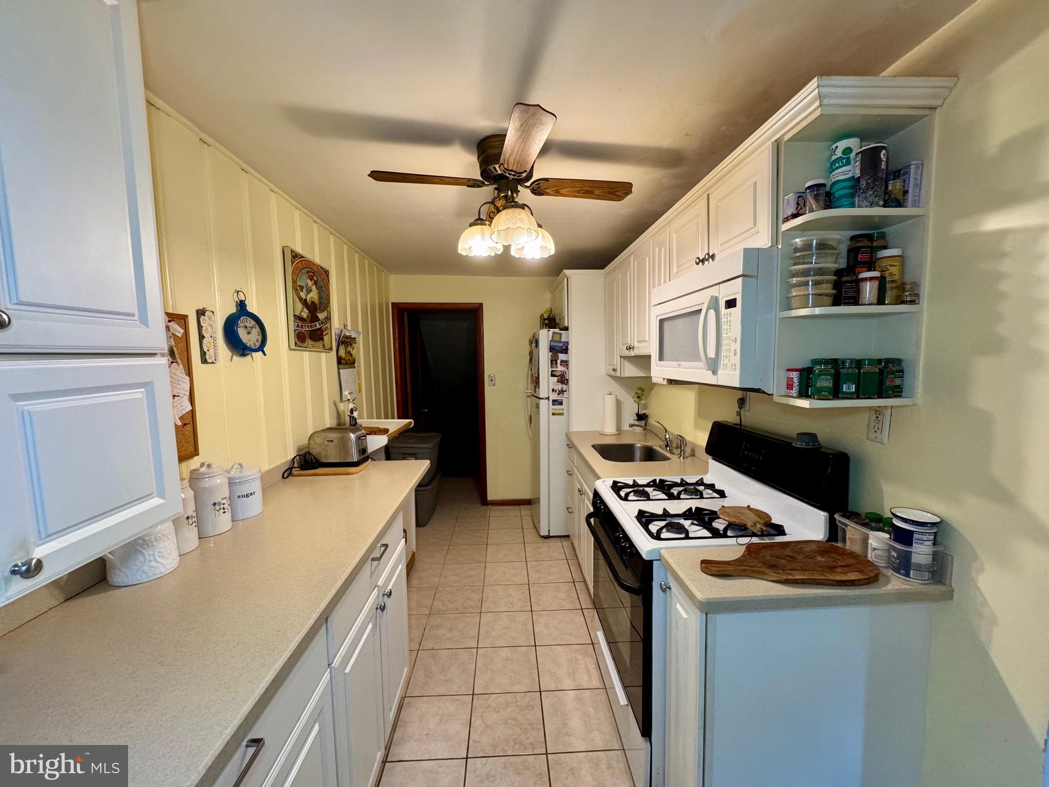 236 Willard Drive Ridley Park, PA 19078 - Photo 6 of 19 a kitchen with stainless steel appliances a stove a sink and a refrigerator