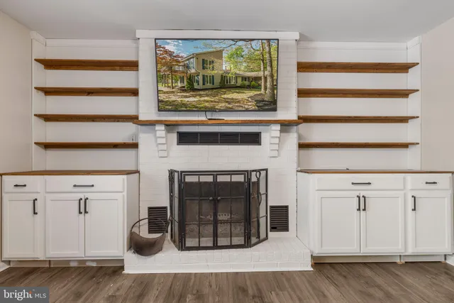 a kitchen with stainless steel appliances granite countertop a stove microwave and cabinets