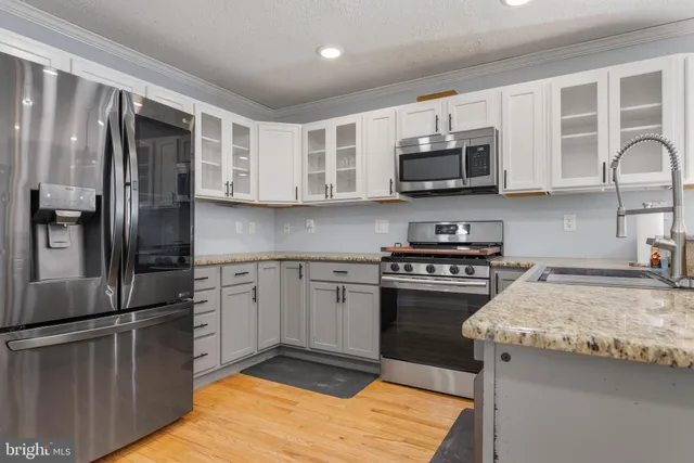 a view of an entryway with wooden floor