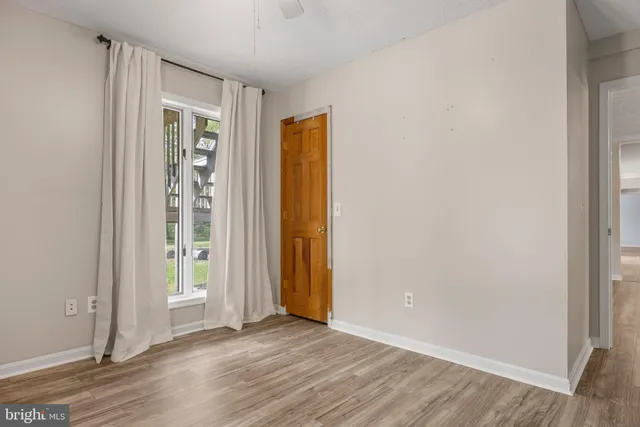 a bathroom with a sink toilet and a window