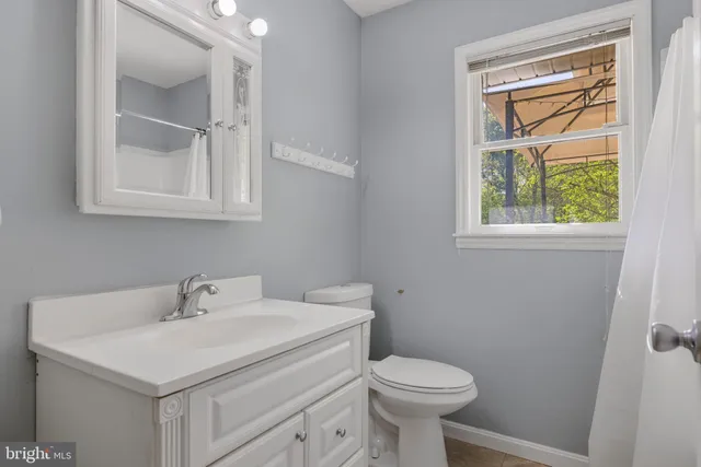 an aerial view of a house with swimming pool and sitting area