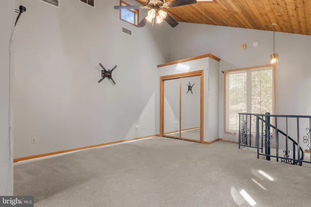 a backyard of a house with lots of plants