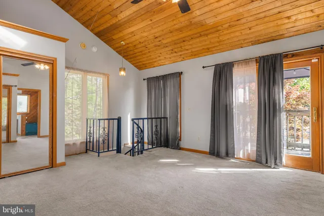 a backyard of a house with lots of green space and garden