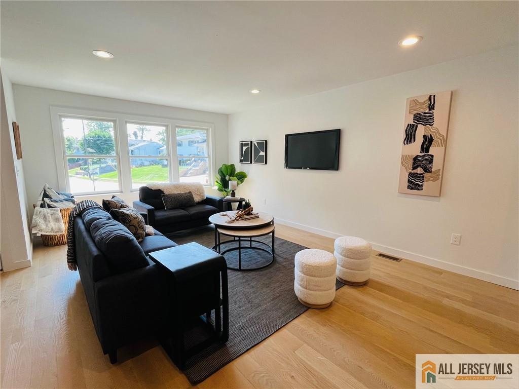 42 Larchmont Road Edison, NJ 08837 - Photo 13 of 36 a living room with furniture and a flat screen tv