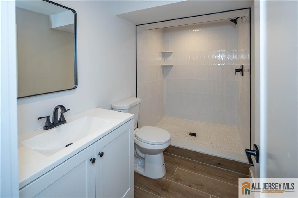 42 Larchmont Road Edison, NJ 08837 - Photo 24 of 36 a bathroom with a sink toilet and shower