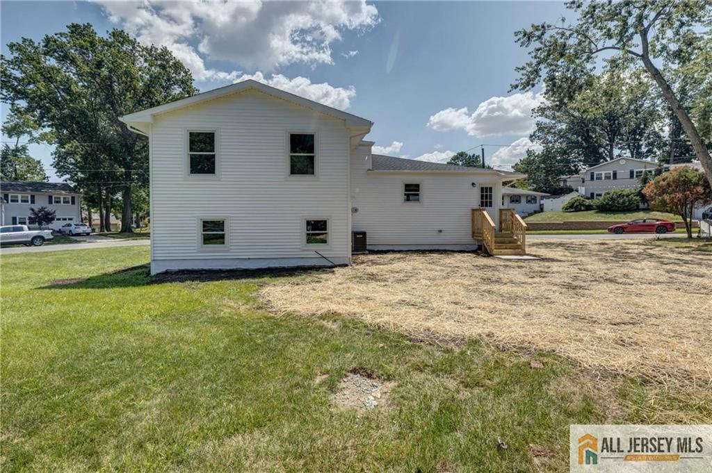 42 Larchmont Road Edison, NJ 08837 - Photo 28 of 36 a house view with a backyard space