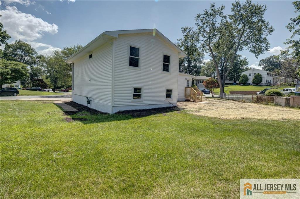 42 Larchmont Road Edison, NJ 08837 - Photo 30 of 36 a view of a house with a yard