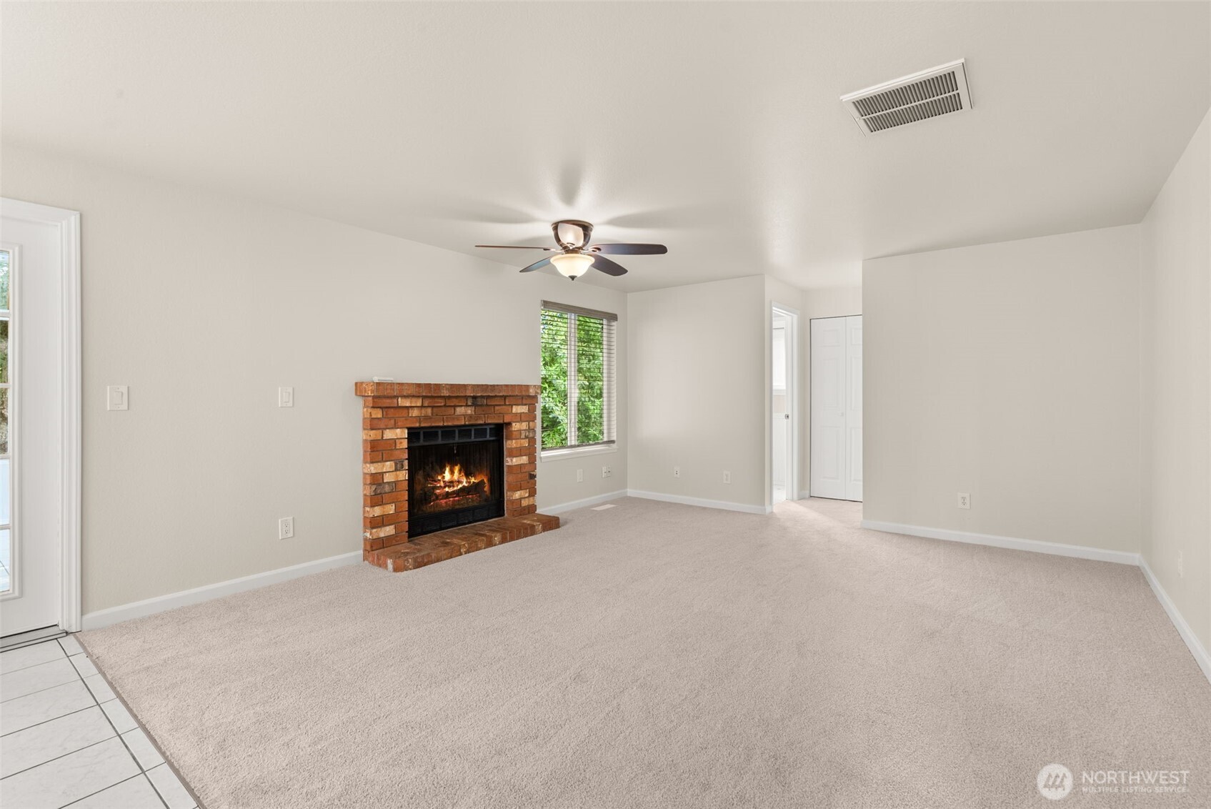 13603 Southeast 239th Street Kent, WA 98042 - Photo 7 of 23 a view of a livingroom with a fireplace