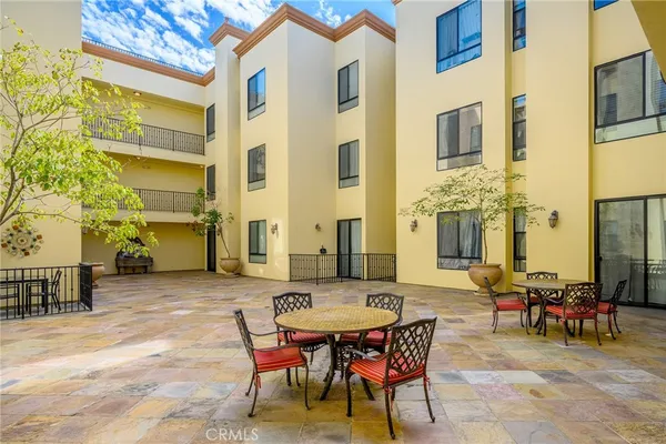a view of a dinning tables and chairs in the patio
