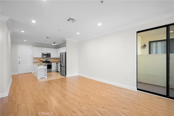 a view of kitchen with stainless steel appliances kitchen island