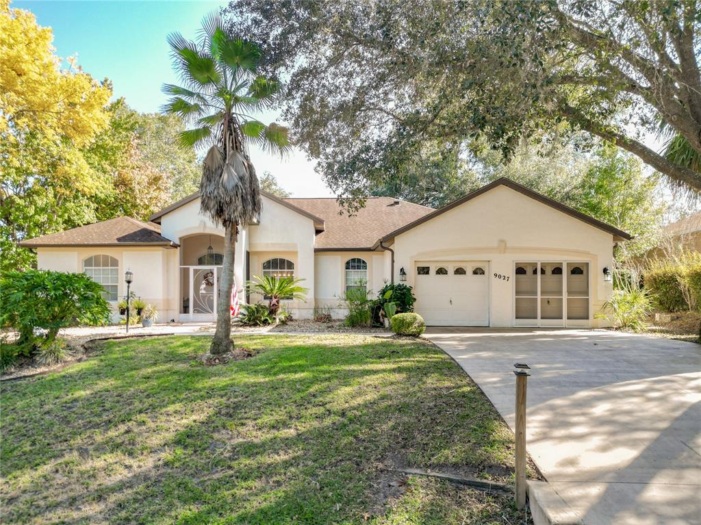 a front view of a house with a yard and porch