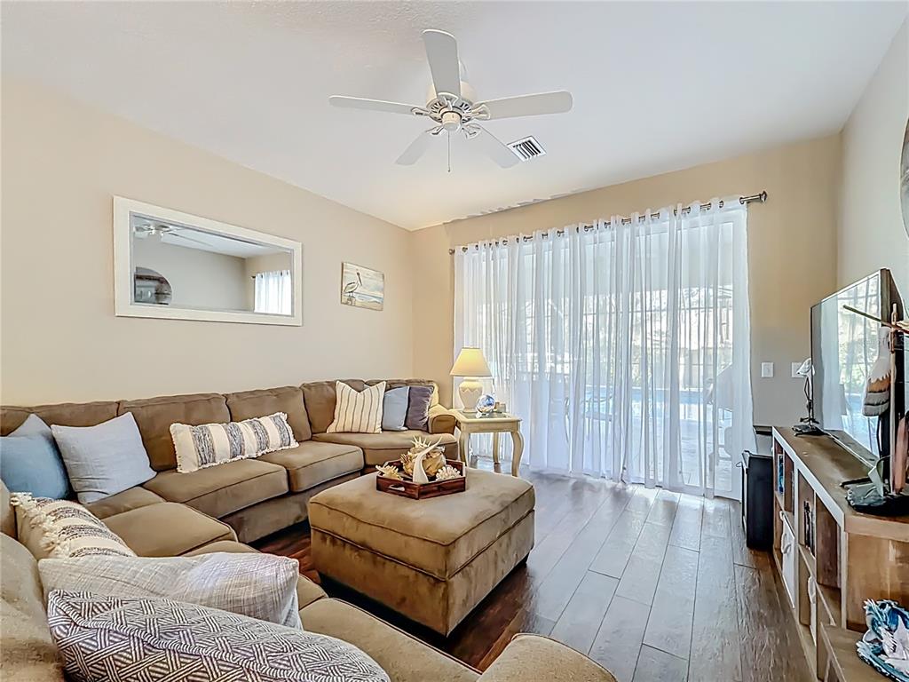 9027 Southwest 196th Court Dunnellon, FL 34432 - Photo 12 of 50 a living room with furniture and a flat screen tv