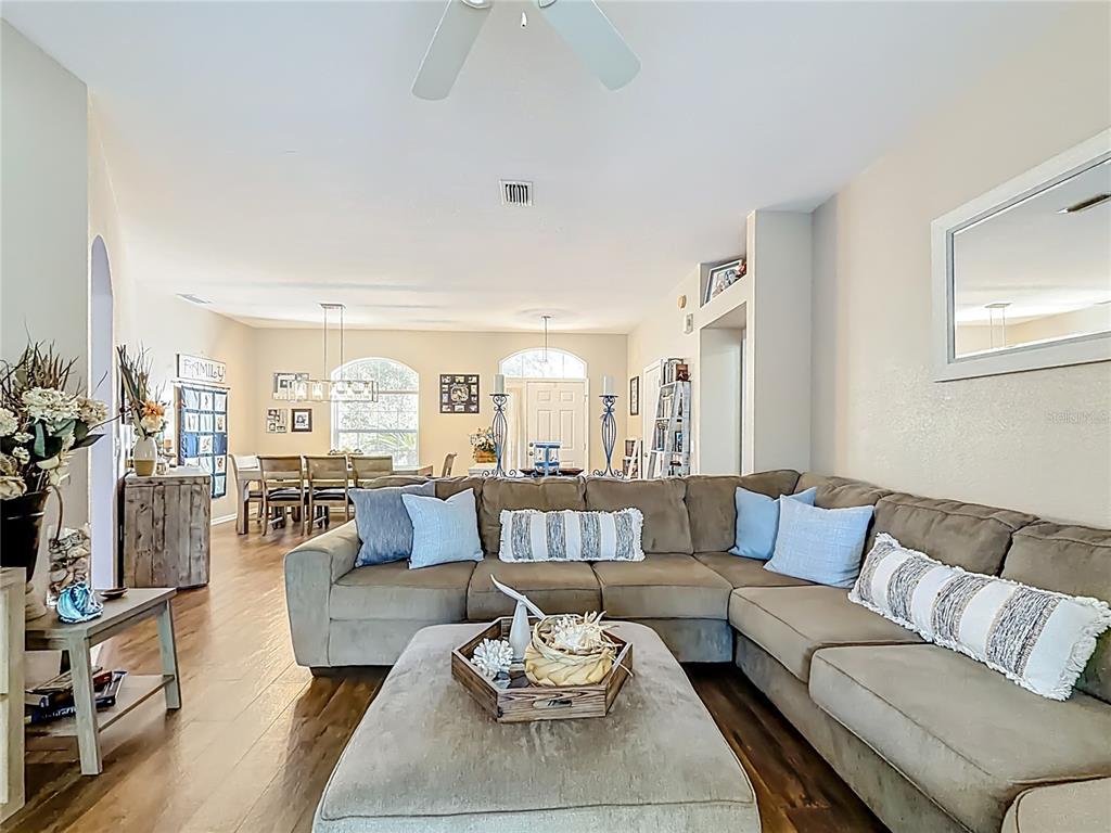 9027 Southwest 196th Court Dunnellon, FL 34432 - Photo 13 of 50 a living room with furniture and a large window