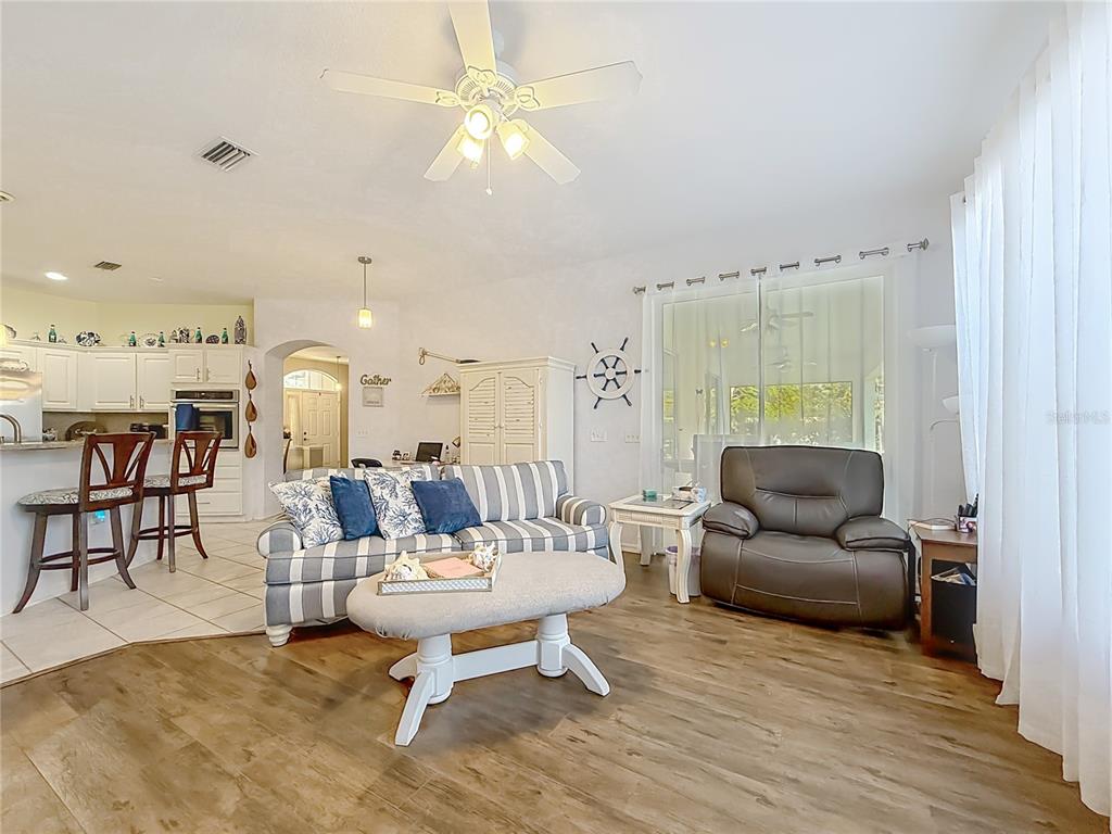9027 Southwest 196th Court Dunnellon, FL 34432 - Photo 22 of 50 a living room with furniture and a large window