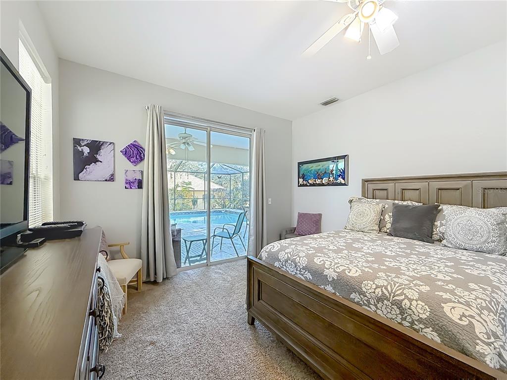 9027 Southwest 196th Court Dunnellon, FL 34432 - Photo 24 of 50 a bedroom with a bed and a window