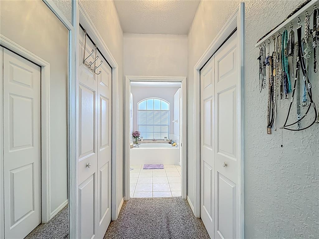 9027 Southwest 196th Court Dunnellon, FL 34432 - Photo 27 of 50 a view of a hallway with wooden floor and staircase