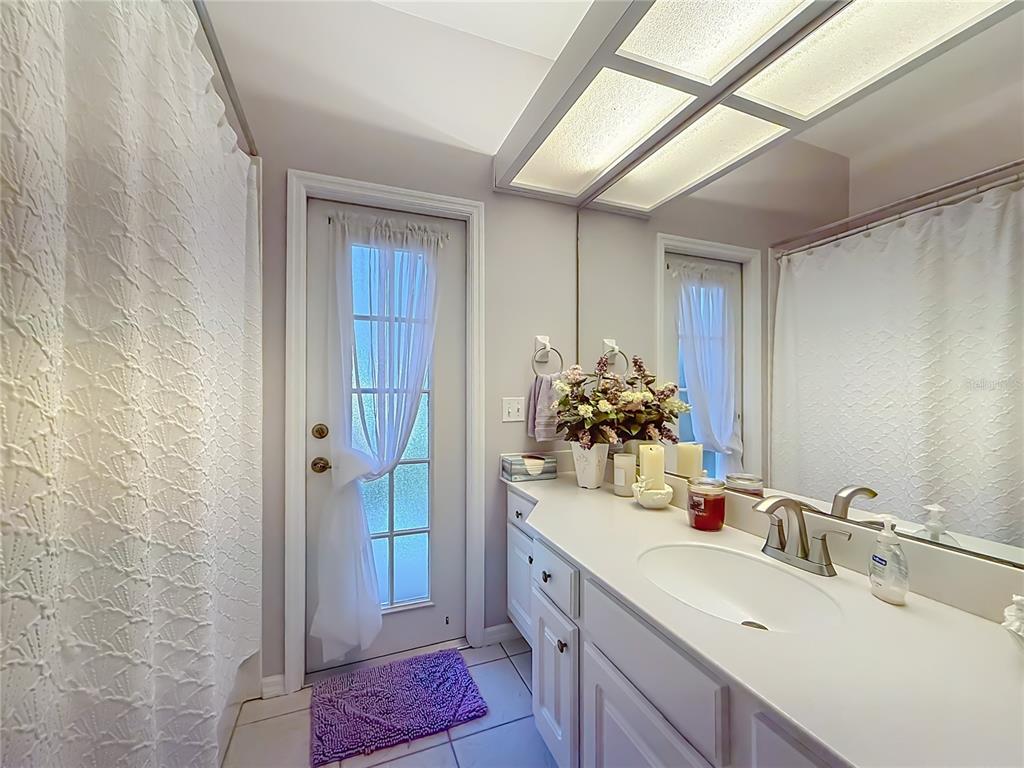 9027 Southwest 196th Court Dunnellon, FL 34432 - Photo 33 of 50 a bathroom with a sink and a mirror