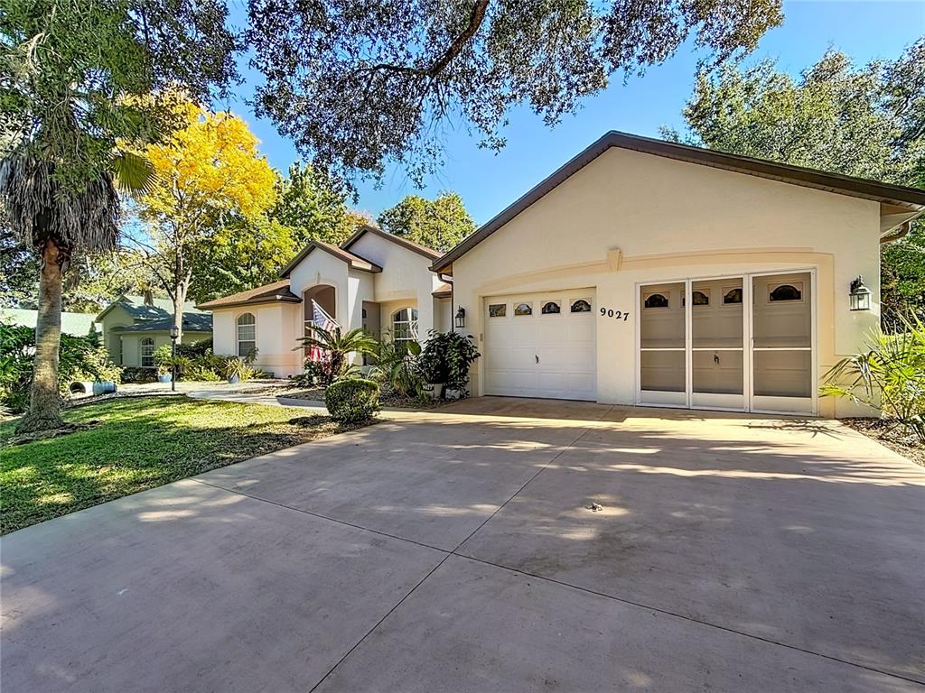 9027 Southwest 196th Court Dunnellon, FL 34432 - Photo 4 of 50 a view of a house with backyard and a tree